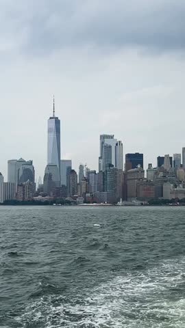 Timelapse of lower Manhattan skyline on a bright sunny day in New York City. Vertical video