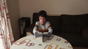 Young Boy Using Digital Tablet and Stylus at Home - Powered by Shutterstock - Get 15% off with code: PIKWIZARD15