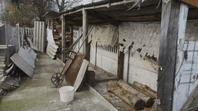 A shed with a lot of junk in front of it. - Powered by Shutterstock - Get 15% off with code: PIKWIZARD15
