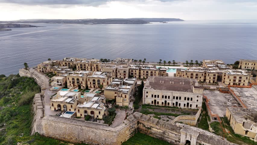 Aerial view of historic buildings and coastal landscape in Gozo, Malta