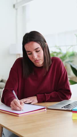 Young woman feeling stressed while working from home