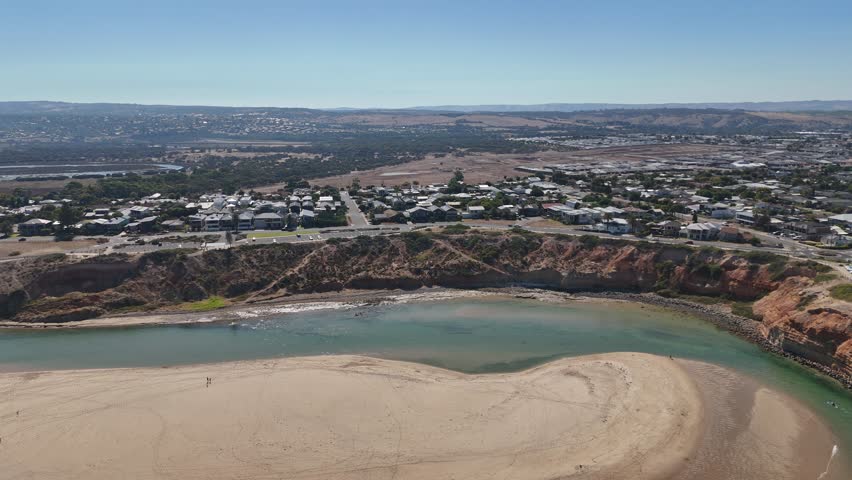 Onkaparinga River, Noarlunga, South Adelaide, South Australia – 4K Aerial Drone Footage of Onkaparinga River Meeting the Ocean with Clifftop Views, Sandbar, and Coastal Suburb of Australia at sunset