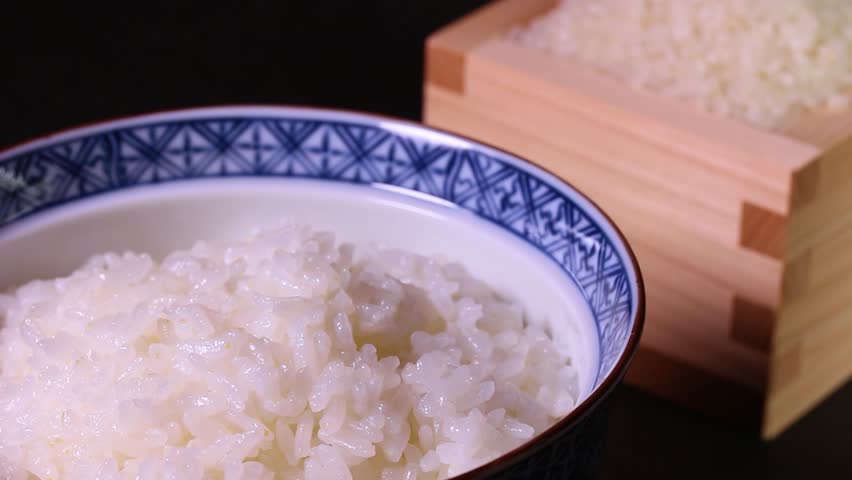 White rice and rice in a bowl, rotating