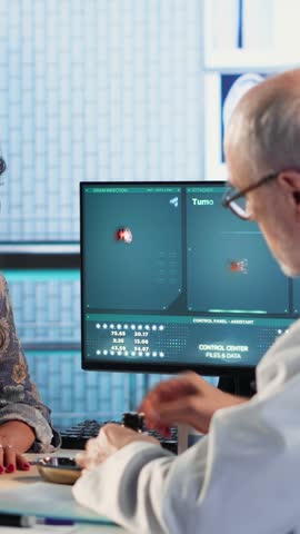 Vertical Video Old physician recommending vitamins and painkillers on medical insurance, writing prescription with instructions and the right dosage of medicine. Healthcare services and pharmaceutics