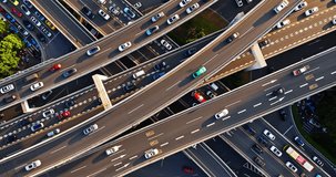 Aerial shot of a complex highway interchange and busy city traffic in the morning - Powered by Shutterstock - Get 15% off with code: PIKWIZARD15
