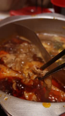 Sichuan mala hotpot Shabu (mala huoguo) set on restaurant table.
