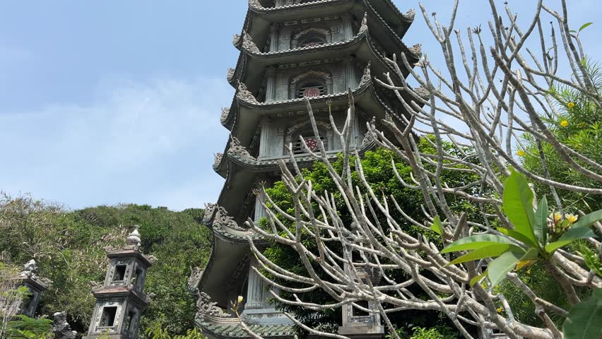 Da Nang, Vietnam 04.10.2025 pagodas temples Buddhist temple in Marble Mountain. In front of the entrance to the temple is a statue of a fat Buddha. 
