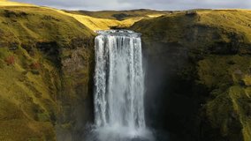 Skogafoss waterfall flowing through green cliffs in Iceland - Powered by Shutterstock - Get 15% off with code: PIKWIZARD15