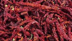 Close up a lot of dried chili peppers. Moving background. - Powered by Shutterstock - Get 15% off with code: PIKWIZARD15