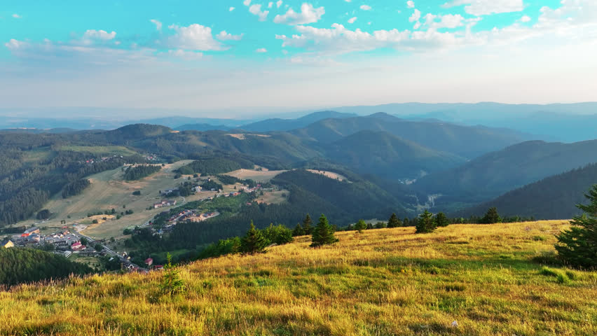Beautiful sunset sky above forested mountains of Slovakia, captured by drone over Veľká Fatra and Donovaly region.