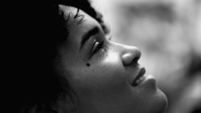 One meditative young black woman closed eyes in quiet contemplation in monochrome, black and white. 20s person engaged in mental reflection - Powered by Shutterstock - Get 15% off with code: PIKWIZARD15