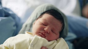 Newborn baby sleeping peacefully with delicate features and closed eyes. baby is wrapped in a soft blanket, emphasizing the serene and calm atmosphere, capturing the essence of newborn innocence - Powered by Shutterstock - Get 15% off with code: PIKWIZARD15