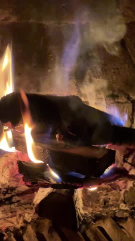A Cozy Fireplace Featuring Dancing Flames and Burning Logs for Ultimate Comfort and Warmth