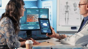 Meeting between doctor and patient to examine MRI scan showing a tumor, exploring treatment options, including immunotherapy, chemotherapy and preventative medicine. Risk factors. Camera B. - Powered by Shutterstock - Get 15% off with code: PIKWIZARD15