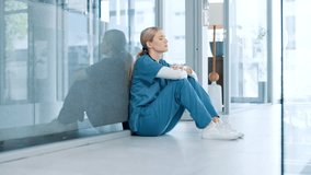 Woman, healthcare and sad nurse in hospital with regret, doubt and overwhelmed in career. Tired, stress and medical professional with depression in lobby for treatment fail, bad news and patient loss - Powered by Shutterstock - Get 15% off with code: PIKWIZARD15
