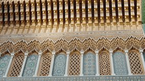 Ornate Moroccan architecture with intricate details, vibrant colors, and traditional patterns. This stunning building showcases the rich cultural heritage of Morocco. Perfect for travel, history, - Powered by Shutterstock - Get 15% off with code: PIKWIZARD15