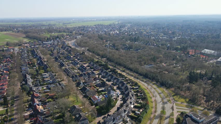 Stunning aerial of a beautiful small town in the Netherlands with a idyllic suburban neighborhoods