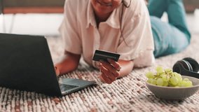 Online shopping, hands and woman with debit card, laptop and browsing on website for ecommerce in home. House, customer and person with credit for payment, happiness and choice for digital product - Powered by Shutterstock - Get 15% off with code: PIKWIZARD15