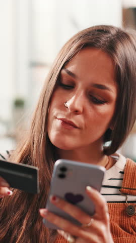 Credit card, happy and woman with phone for online shopping, purchase and payment in home. Ecommerce, information and girl on smartphone for website sale, discount and internet banking in living room