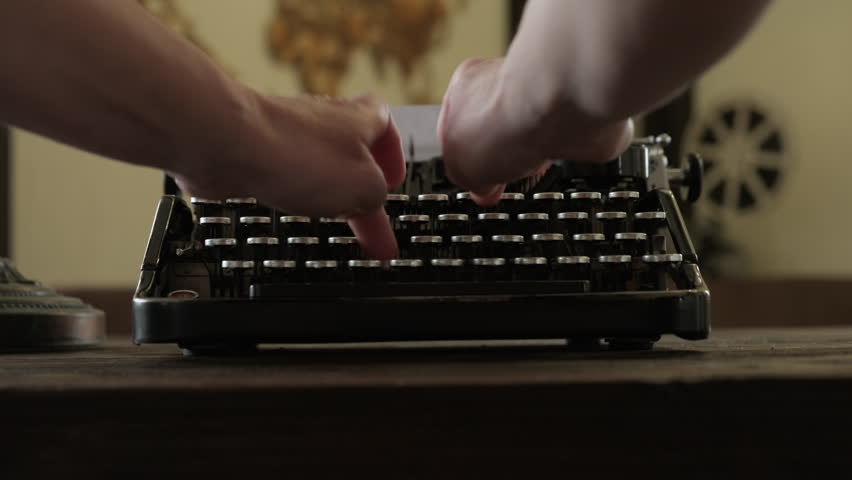 Writer typist hands typing on vintage typewriter in home office, female fingers pressing on keyboard close up