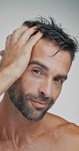 Man, hair care and happy with face in studio for grooming, results or confident by background. Mature person, model and shirtless for pride, wellness or routine with change for hairstyle in Argentina