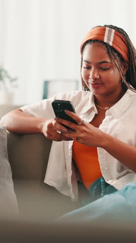 Gen z, phone and black woman in home with smile on dating website, texting app or chat subscription. Happy, social media and girl with mobile message or meme for post, flirting and romantic match