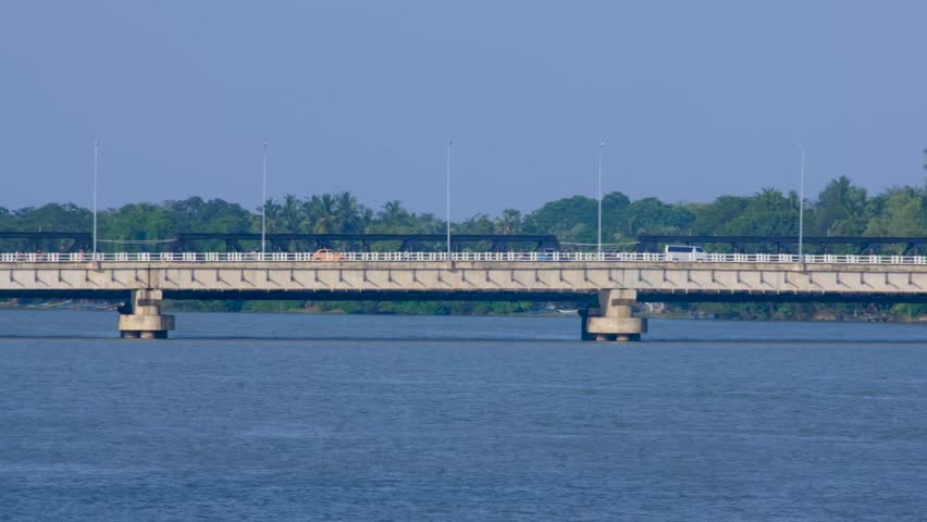 Scenic view of New Kallady Bridge over lagoon water in Batticaloa Sri Lanka with busy traffic