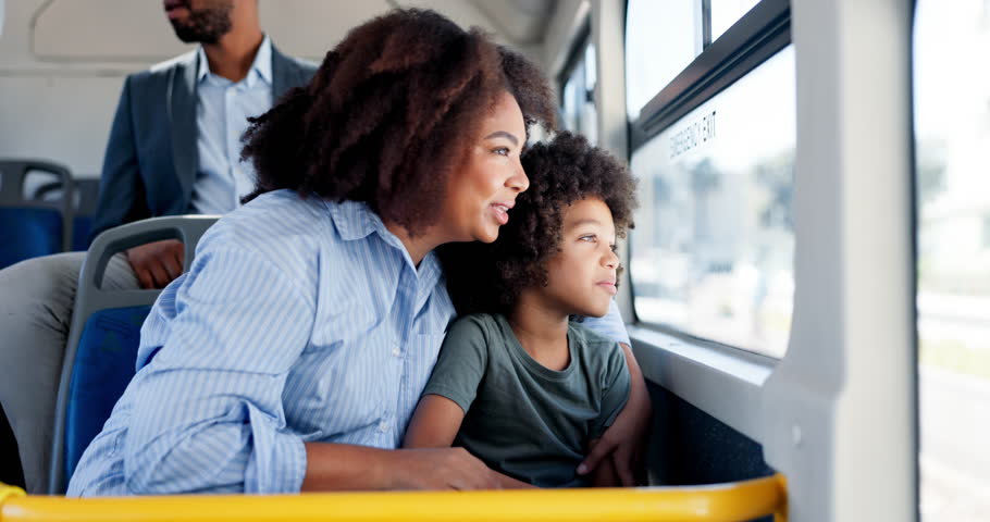 Happy, mother and child travel on bus with window, city commute and sightseeing adventure. Bonding, woman and curious son on public transport for family trip, discussion or journey on weekend break