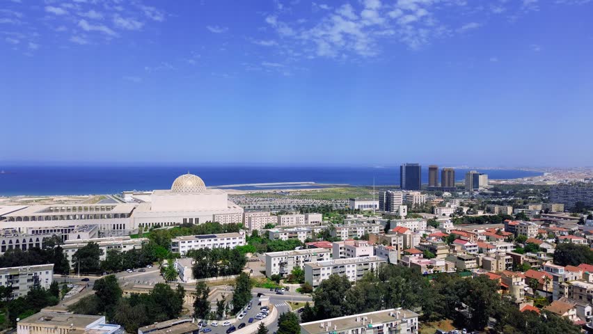 drone shot of the great mosque of algiers with the sea view in the background on a sunny day - Mohammadia - Algeria