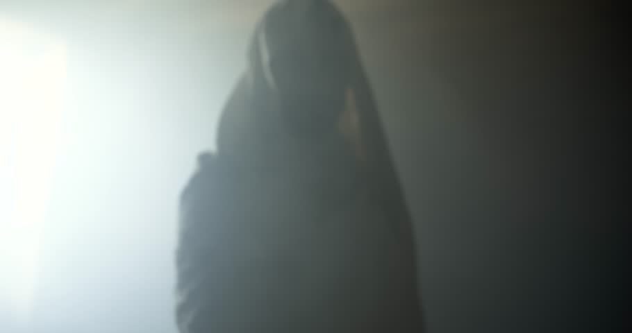 Jesus Christ in glowing, ambient, light offering his hand for salvation, forgiveness. Cinematic visual representation of Easter resurrection, the gospel, and God