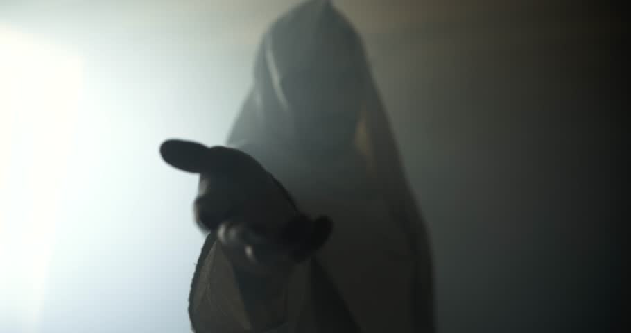 Jesus Christ in glowing, ambient, light offering his hand for salvation, forgiveness. Cinematic visual representation of Easter resurrection, the gospel, and God's love and forgiveness.