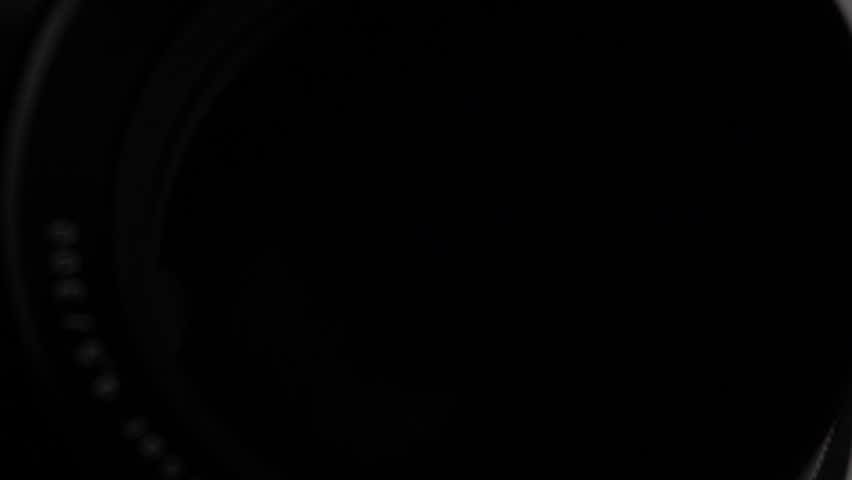 Camera lens close up. Opening and closing aperture. Light reflections. Movement. Large format professional camera