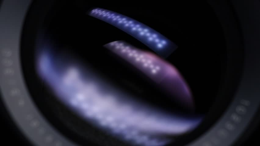 Camera lens close up. Opening and closing aperture. Light reflections. Movement. Large format professional camera