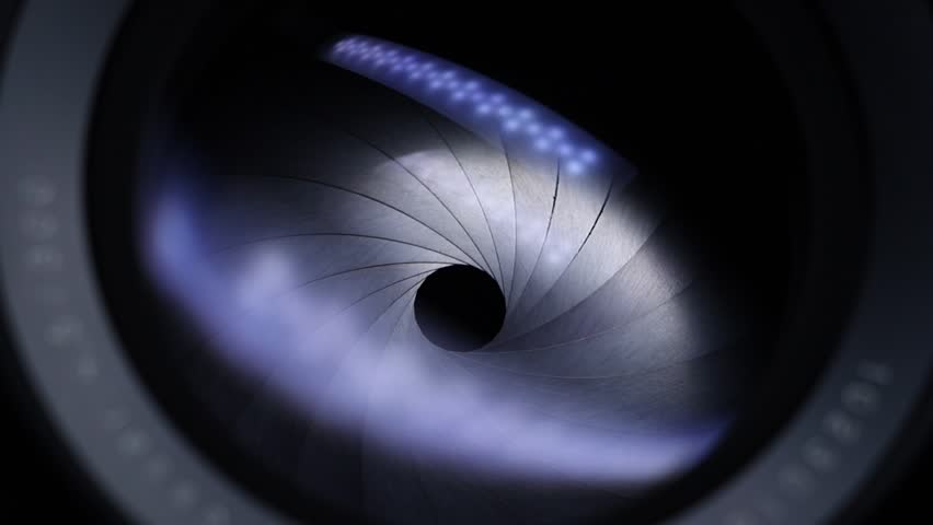 Camera lens close up. Opening and closing aperture. Light reflections. Movement. Large format professional camera