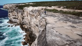 Dramatic Coastal Cliffs, Ocean Waves Crashing, Eroded Sandstone - Powered by Shutterstock - Get 15% off with code: PIKWIZARD15