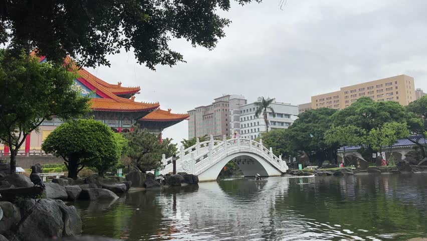 Chiang Kai-shek Memorial Hall building temple in taipei city taiwan bridge over the pond