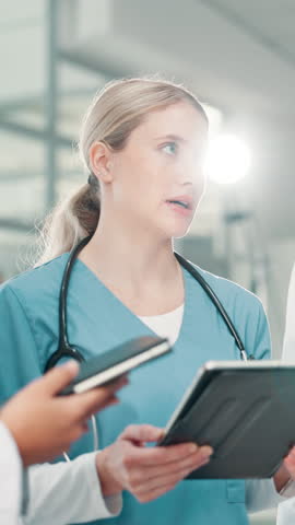 Woman, discussion and doctor on tablet at hospital for planning, feedback and medical results of surgery. Person, talking and digital for staff update, healthcare report and brainstorming of solution