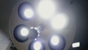 Close-up of a bright medical operating lamp, essential for surgery and hospital procedures, providing optimal illumination for precise medical care.
 - Powered by Shutterstock - Get 15% off with code: PIKWIZARD15