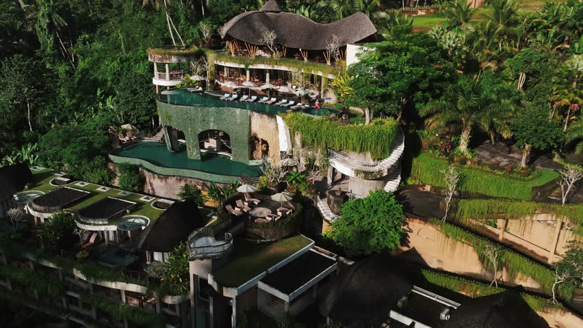 Luxurious hotel suite featuring a sparkling swimming pool, nestled amidst lush greenery, evoking tranquility and opulence.
