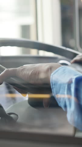 Commute, steering wheel and hands of person on bus for navigation, shuttle service and driving journey. Travel, public transportation and route with closeup of driver for location, traffic and trip