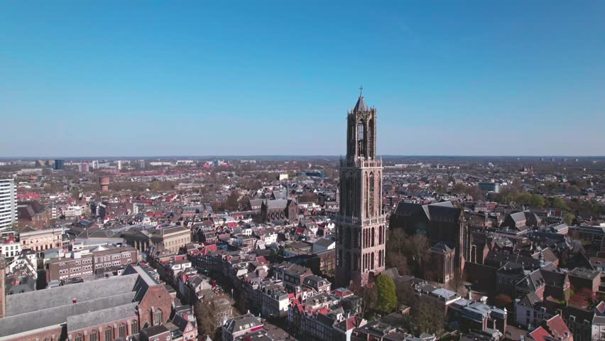 Aerial of typical Dutch city skyline, Utrecht cityscape with renovated Dom tower, canals and houses, Holland, Netherlands