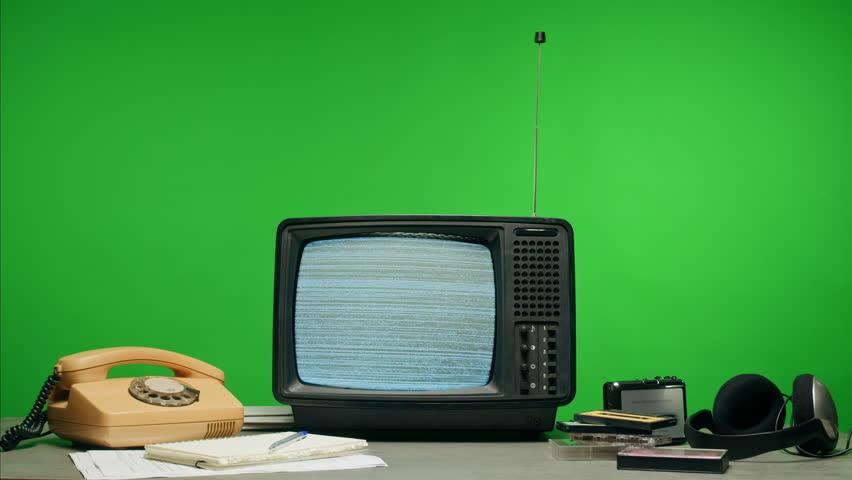 In a nostalgic setup, a retro TV displays static on its screen, reminiscent of an era gone by