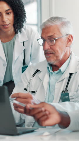 Meeting, doctors and man on laptop in hospital for medical service, research and planning. Healthcare, clinic team of men and women on digital tech for online schedule, consulting and collaboration