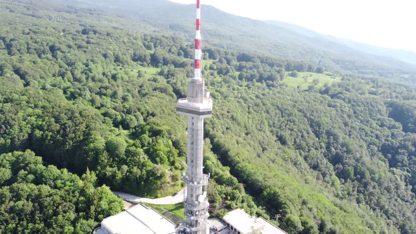 Drone Climbing to Tower Peak – Stunning City and Forest View