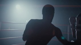 Young African American fighters conduct training sparring on boxing ring. Strong black sportsmen practice punches for competition on athletic club arena - Powered by Shutterstock - Get 15% off with code: PIKWIZARD15