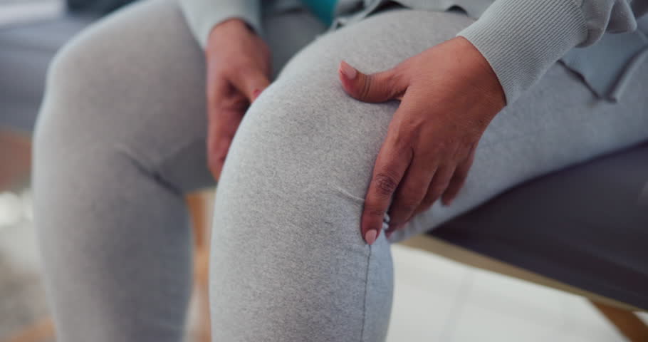 Knee pain, injury and woman with hands, muscle tension or cramps with health massage for physical therapy. Joint ache, stress or burnout, injured leg and female person at home with inflammation