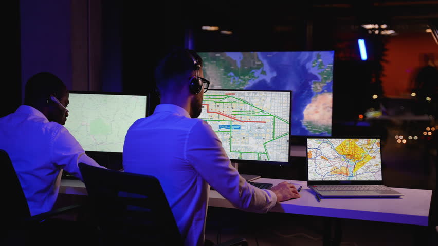 Two multiracial dispatchers monitoring freight deliveries live - Powered by Shutterstock - Get 15% off with code: PIKWIZARD15