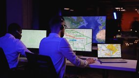 Two multiracial dispatchers monitoring freight deliveries live - Powered by Shutterstock - Get 15% off with code: PIKWIZARD15