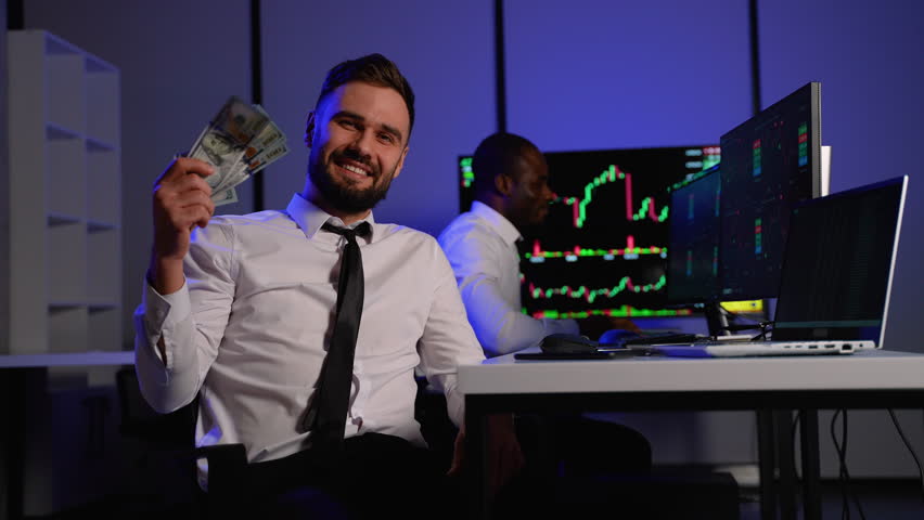 Smiling trader counting money after cryptocurrency market profits