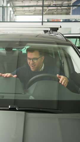 Happy Man Celebrating and Dancing in His New Car